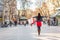 Happy shopping woman walking with bags on Barcelona, La Rambla famous street. Shopper with open arms up in freedom and