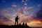 Happy silhouette friends people person having fun sitting on top of a rock hill mountain playing guitar guitarist musician , copy