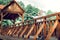 Happy silver-haired spouses standing on the wooden brown bridge