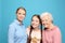 Happy sisters with their grandmother