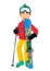 Happy skier wearing red jacket, green hat and goggles holding skis and poles standing over white background