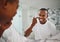Happy, skincare and mirror with black man in bathroom for beauty, morning and grooming. Cleaning, hygiene and self care