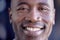 Happy, smile and closeup portrait of a black man with a positive, good and healthy mindset. Happiness, headshot and zoom