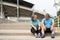 Happy and smile couples elderly asian sitting on stairs for rest after workout, jogging on morning, senior exercise outdoor for