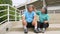 Happy and smile couples elderly asian sitting on stairs for rest after workout, jogging on morning, senior exercise outdoor for