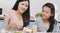 Happy smiled mother and daughter making sandwiches