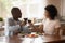 Happy smiling african american family couple holding glasses of wine.