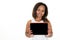 Happy smiling african black american young woman cheerful showing blank empty tablet computer screen aside copy space