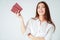 Happy smiling asian young long hair woman with two passports on white background isolated