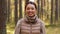 Happy smiling asian young woman in forest