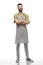 Happy smiling barman in apron with crossed arms