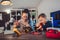 Happy smiling boy and girl constructs technical toy and make robot.