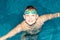 A happy smiling boy swims in the sea. Close-up. Healthy lifestyle. Swimming. Sports and recreation