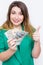 Happy smiling businesswoman wearing in green jacket with thumbs up gesture and money. Closeup portrait super happy excited success