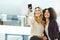 Happy, smiling and cheerful women taking selfies with a phone while bonding, having fun and being carefree at work