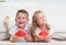 Happy smiling children eating watermelon