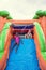 Happy smiling children playing on an inflatable slide bounce house