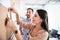 Happy smiling coworkers standing near wall