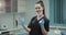 Happy smiling dentist nurses assistant preparing a surgical syringe for a injection looking straight on the camera and