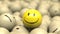 Happy smiling emoji ball sitting on top of a bunch of sad smile balls.