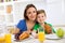 Happy smiling family eating healthy fresh breakfast