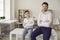 Happy smiling father and son in stylish formal wear posing for camera portrait