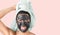 Happy smiling girl applying facial black mask - Young woman having skin care cleanser spa day