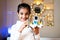 Happy Smiling Girl kid with small DIY robot in Hand looking at camera - Concept of Child Prodigy, Scientific experiment, Knowledge