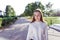 Happy smiling Girl teenager 12-15 years old, autumn day, street portrait, knitted white sweater, summer park. Resting