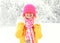 Happy smiling girl wearing colorful knitted clothes having fun in winter day