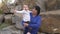 Happy smiling grandmother and little cute granddaughter at park