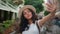Happy smiling Indian Arabian ethnic woman girl female student tourist traveler influencer taking selfie photo mobile