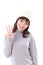 Happy, smiling, joyful woman wearing knit hat, showing 3 fingers