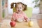 Happy smiling kid eating oatmeal with fruits. The concept of healthy breakfast for children.