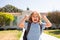 Happy smiling kid is going to school. Child boy with bag go to elementary school. Excited pupil go study with backpack