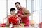 Happy smiling LGBT couple sharing special moment together on Valentine Day, Asian gay male lover cooking meal drinking hot