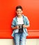 Happy smiling little boy teenager with retro vintage camera