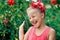 Happy smiling little girl portrait dancing on summer day in the street