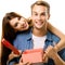 Happy smiling lovely couple opening gift box. Love, relationship, dating, lovers concept, isolated against white background