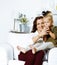 Happy smiling mother with little cute daughter at home interior, casual look modern real family, lifestyle people