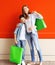 Happy smiling mother and son child with shopping bags having fun