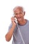 Happy, smiling, relaxed old senior man using telephone