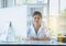 Happy and smiling scientist asian women working and using computer keyboard on desk in office room,Fingers typing close up