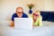 Happy smiling senior couple looking at the screen of a laptop