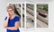 Happy smiling senior woman stands inside near threefold pvc window pane with hoisy highway with cars on background