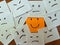 Happy smiling sticky note among unhappy, sad, angry and emotional face drawings.
