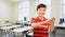 happy smiling student boy applauding at school