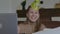 Happy smiling woman in party hat laughing and talking. Portrait of blond joyful lady celebrating distantly on Covid-19