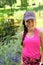 Happy smiling young Asian girl in sportswear sports cap and pink activewear portrait. Chinese Caucasian multiracial