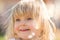 Happy smiling young baby caucasian blonde real people girl close outdoor portrait